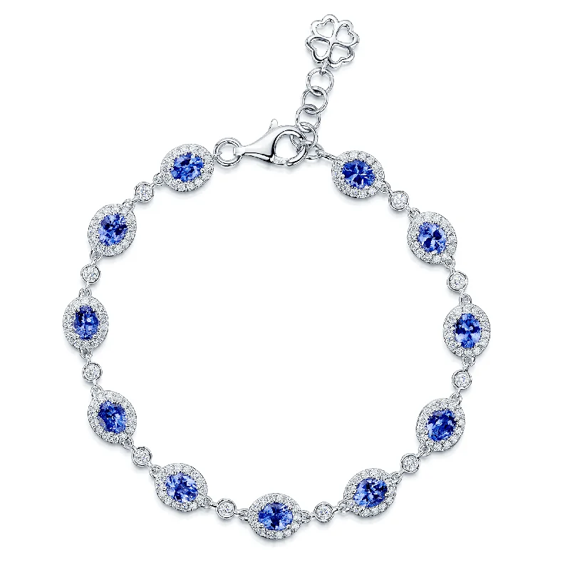 Ladies bracelets rose quartz designs-Ladies bracelets rose quartz designs-18ct White Gold Oval Tanzanite And Diamond Cluster Bracelet