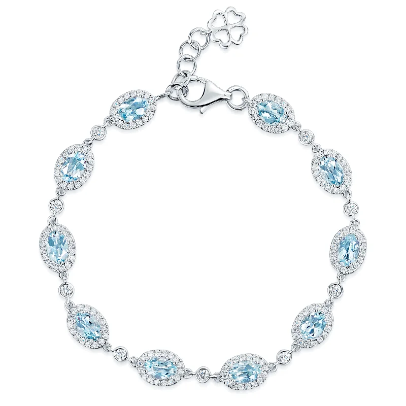 Ladies bracelets hypoallergenic materials-Ladies bracelets hypoallergenic materials-18ct White Gold Oval Cut Aquamarine And Diamond Halo Surround Bracelet