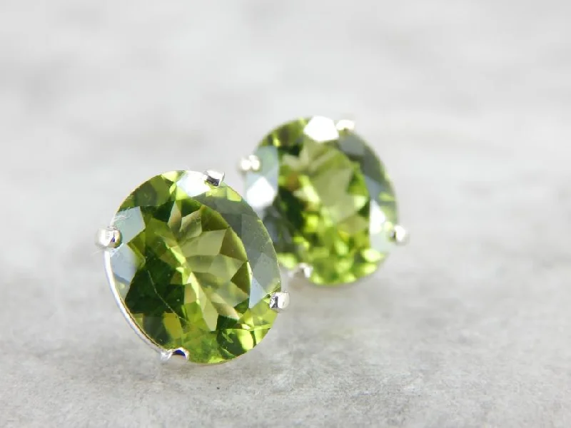 Ladies earrings age-appropriate designs-Large Oval Peridot Stud Earrings in White Gold